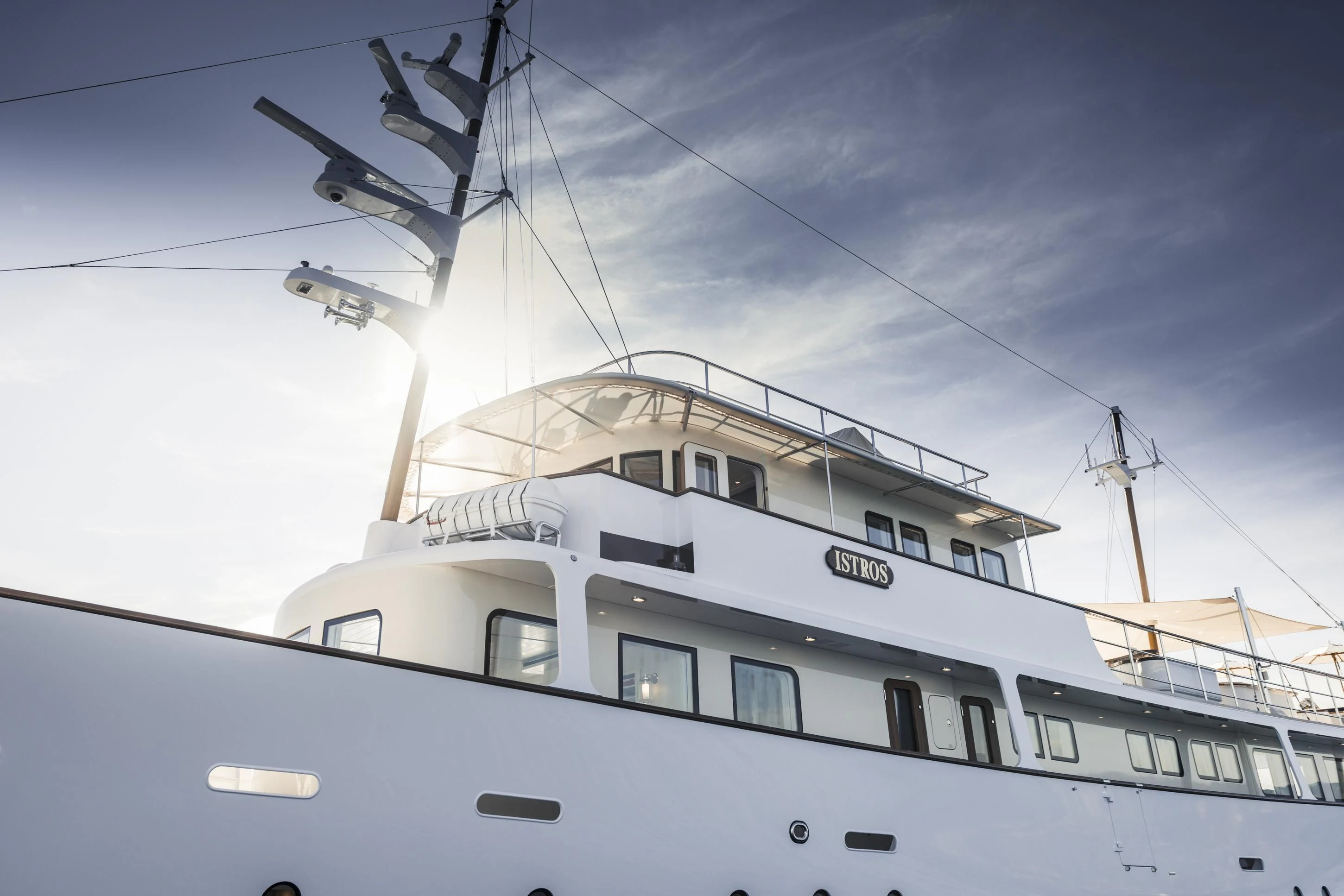 a white boat with a white ship on it aboard ISTROS Yacht for Sale