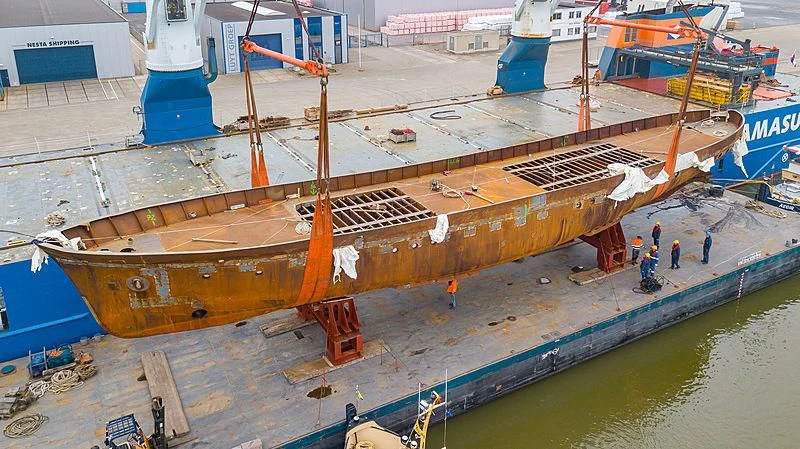 a large ship in a harbor aboard ISTROS Yacht for Sale