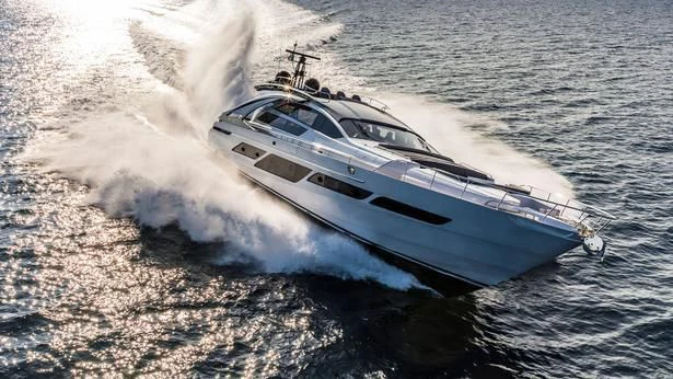 a white yacht on the water aboard QUEEN B SPORT Yacht for Sale