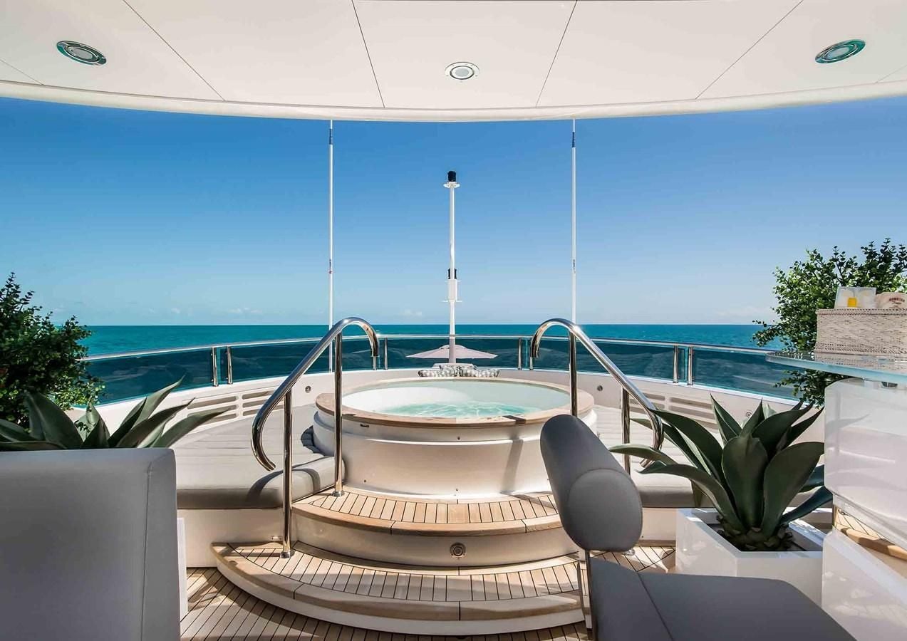 a table on a balcony aboard CAPTAIN MORGAN III Yacht for Sale