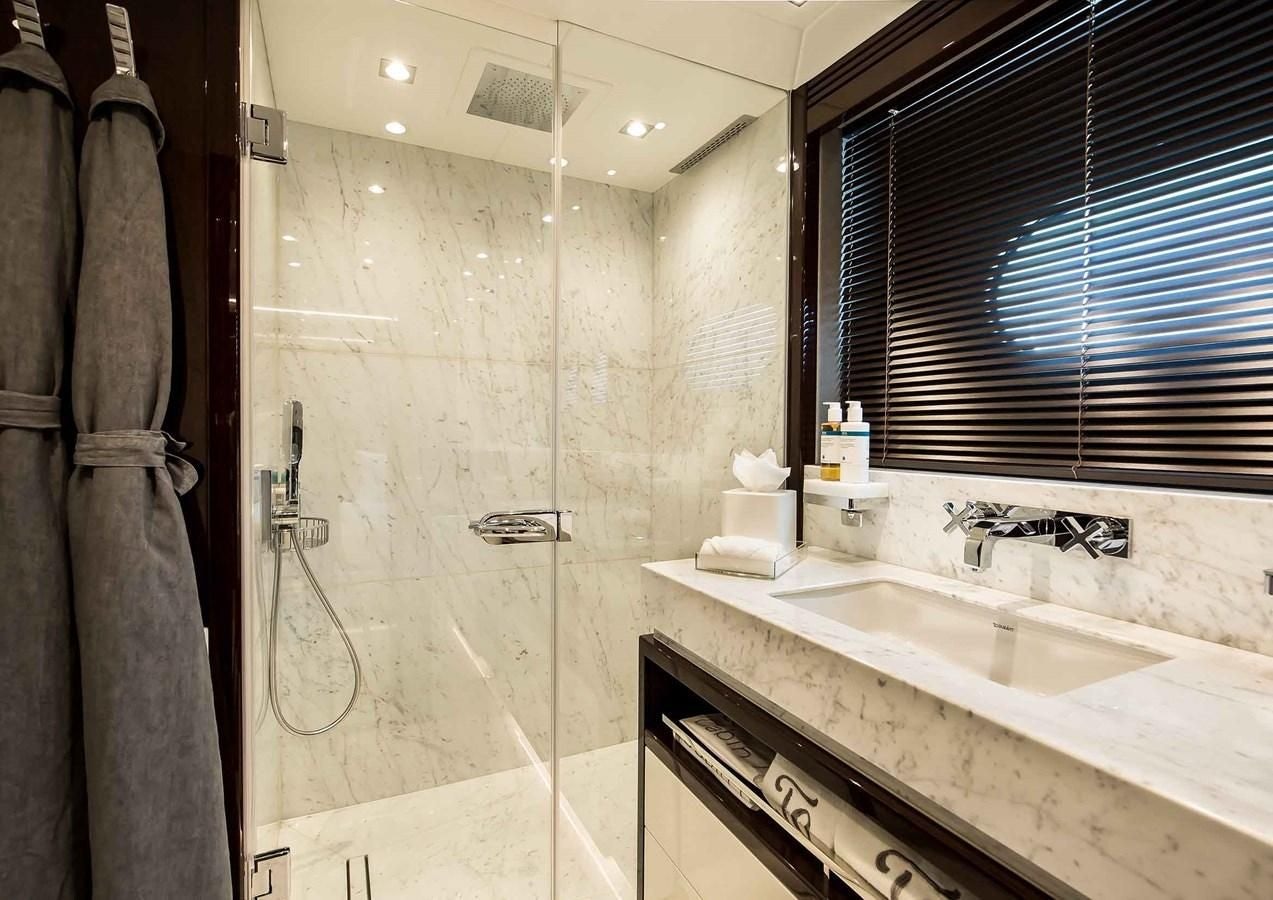 a bathroom with a shower and sink aboard CAPTAIN MORGAN III Yacht for Sale