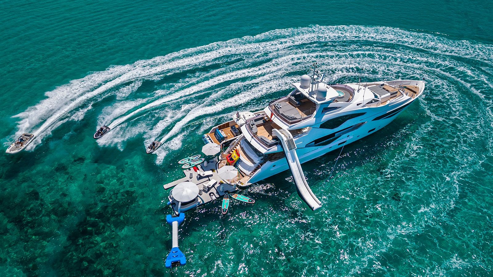a helicopter flying over a body of water aboard CAPTAIN MORGAN III Yacht for Sale