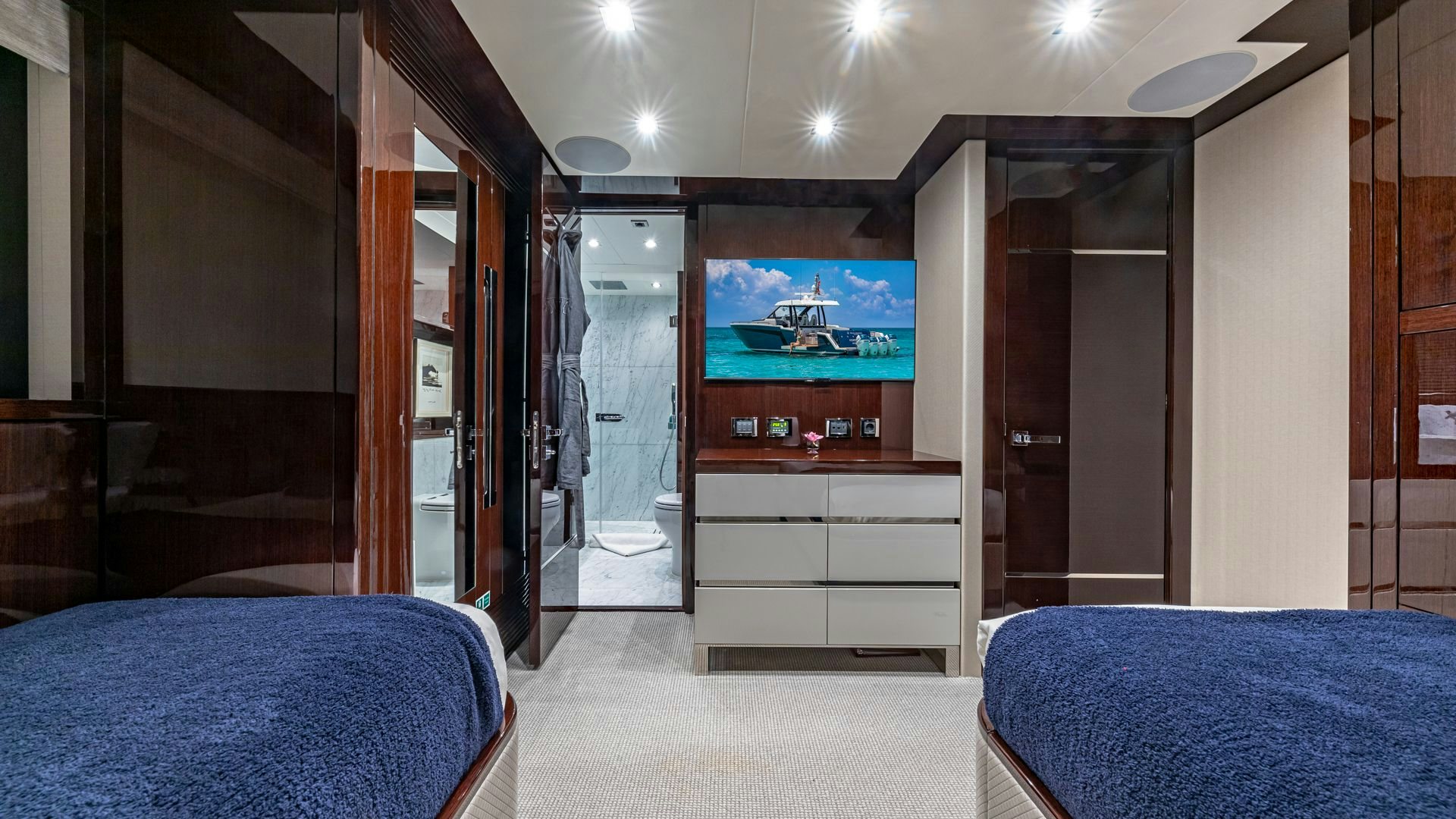 a room with a bed and a tv aboard CAPTAIN MORGAN III Yacht for Sale
