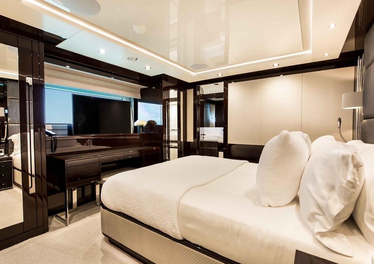 a room with a bed and a piano aboard CAPTAIN MORGAN III Yacht for Sale