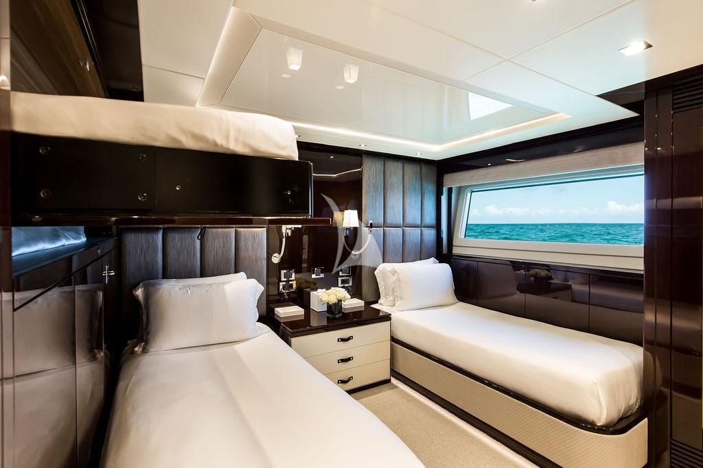 a bedroom with a bed and a tv aboard CAPTAIN MORGAN III Yacht for Sale
