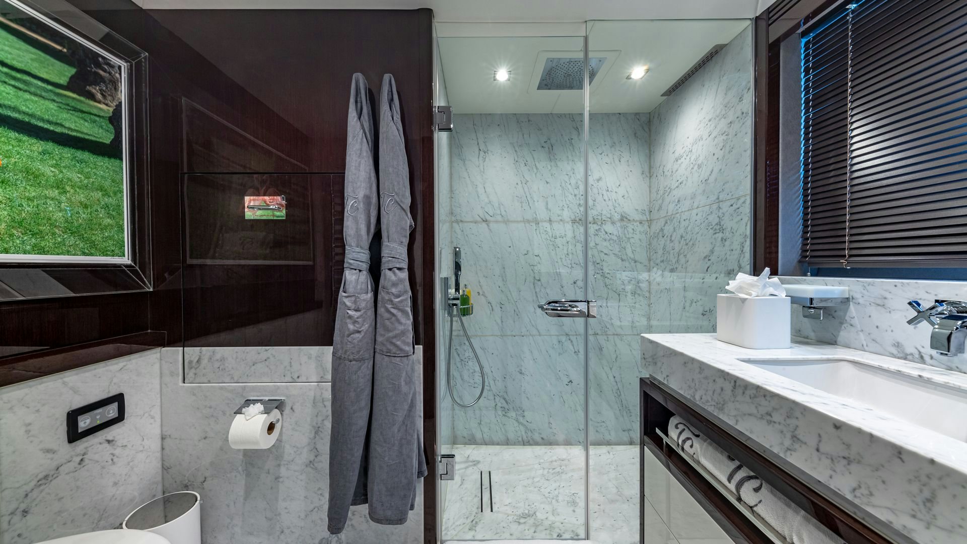 a bathroom with a shower and sink aboard CAPTAIN MORGAN III Yacht for Sale