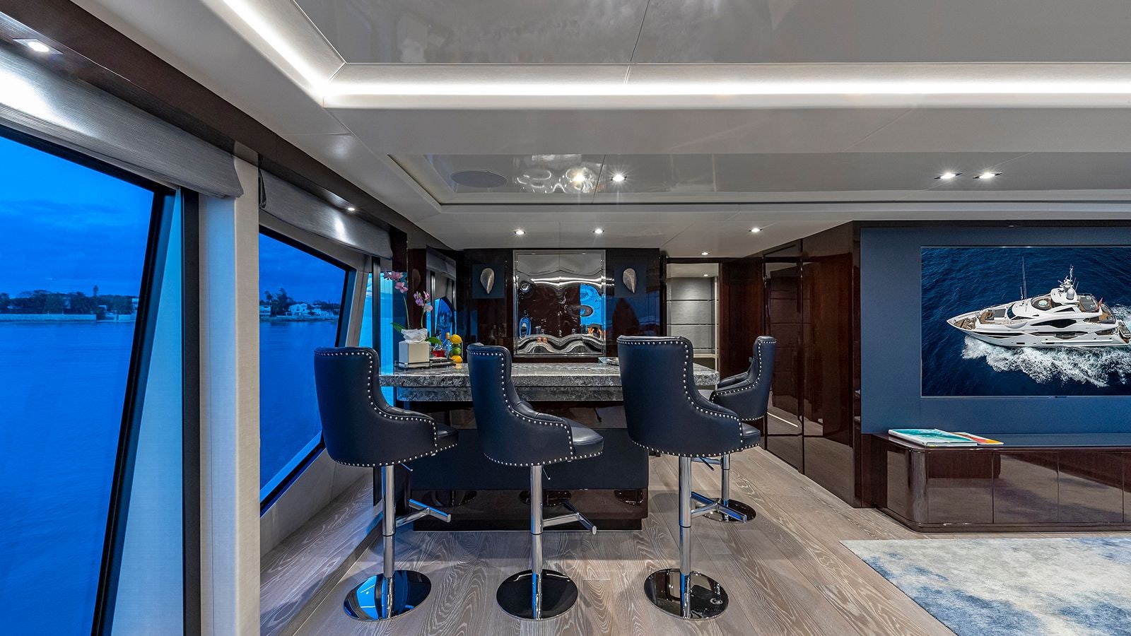 a room with a table and chairs aboard CAPTAIN MORGAN III Yacht for Sale