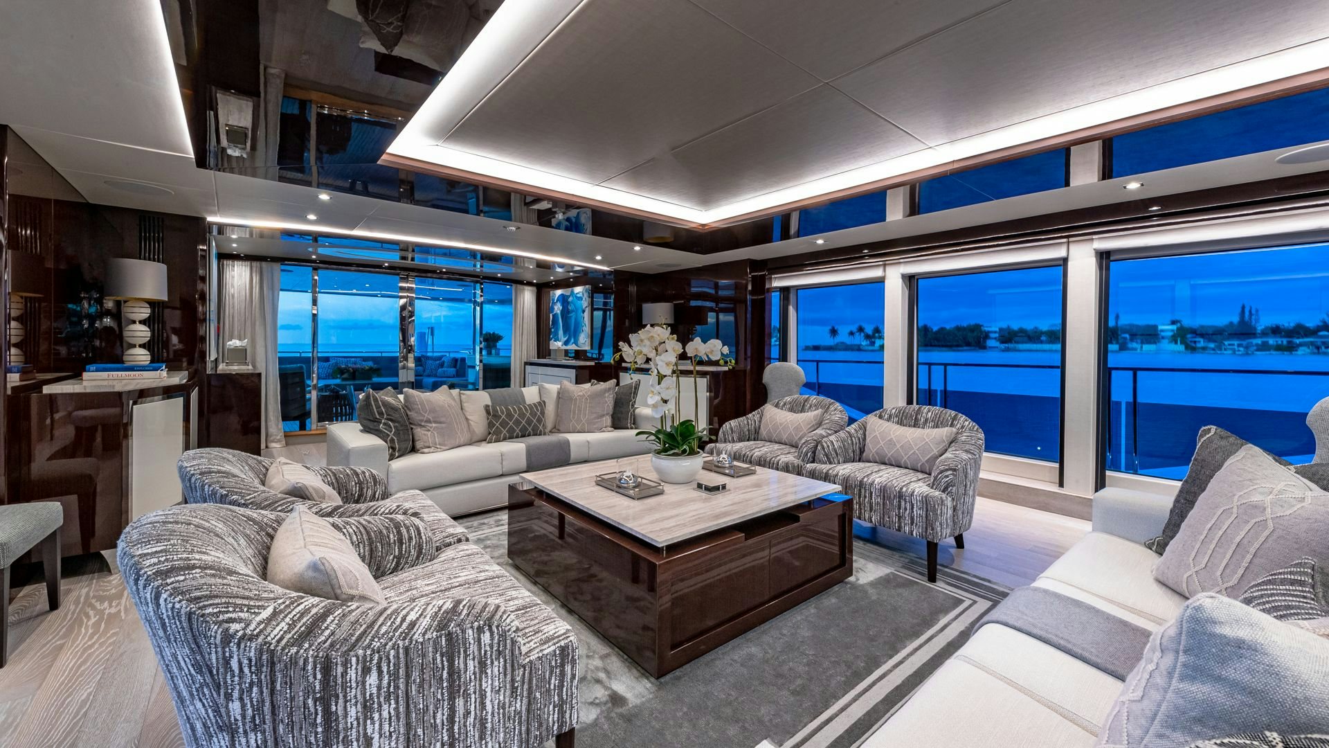 a living room with a large window aboard CAPTAIN MORGAN III Yacht for Sale