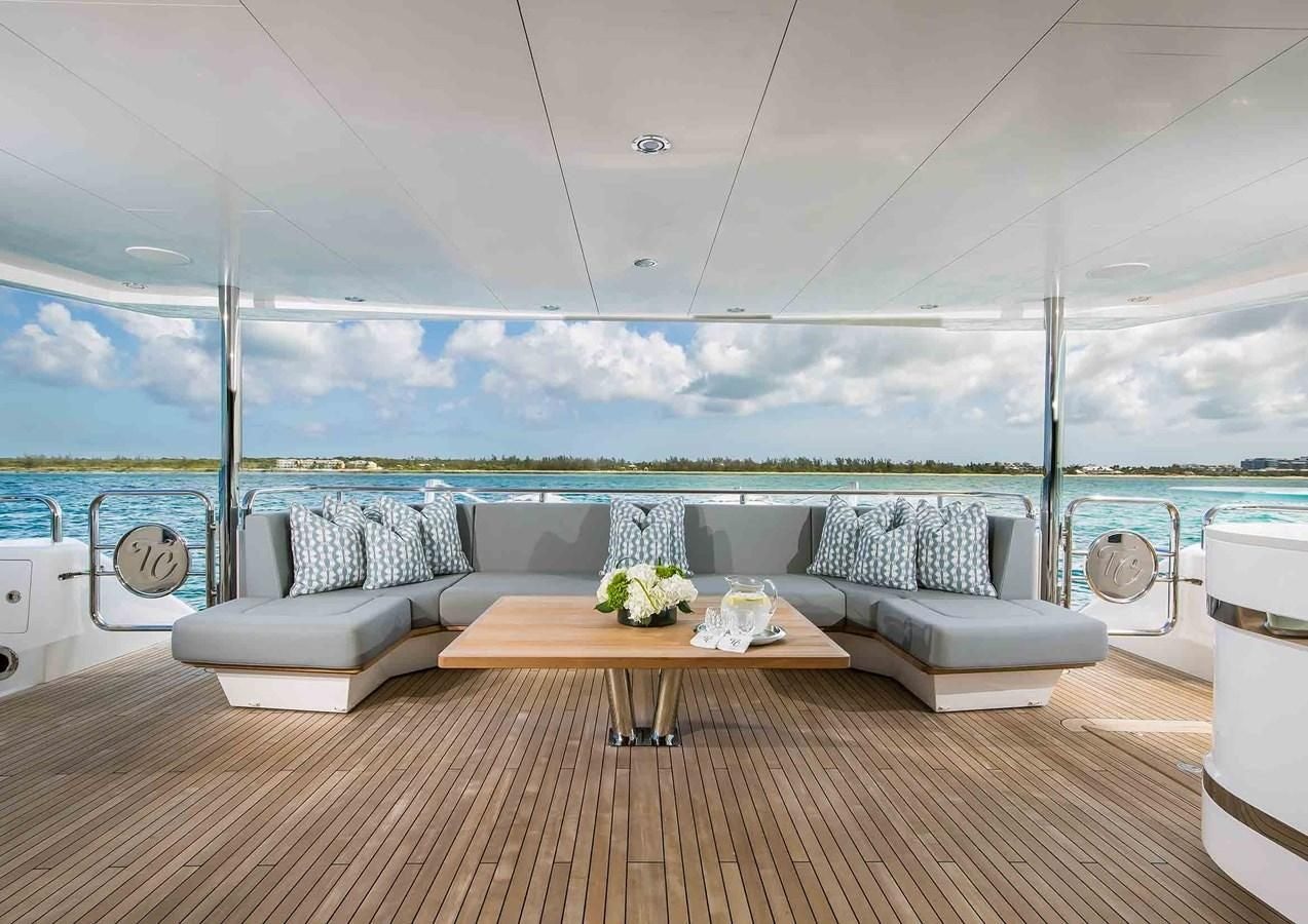 a room with a table and chairs aboard CAPTAIN MORGAN III Yacht for Sale