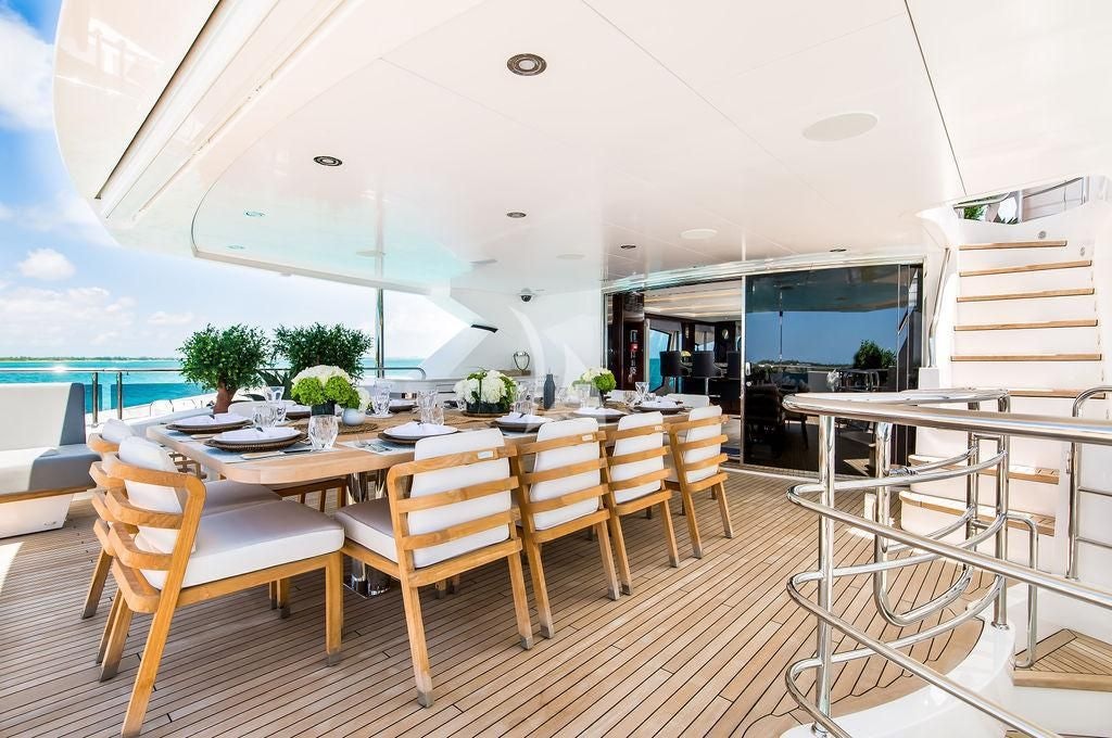 a room with a table and chairs aboard CAPTAIN MORGAN III Yacht for Sale