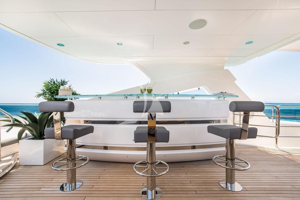 a pool table and chairs aboard CAPTAIN MORGAN III Yacht for Sale