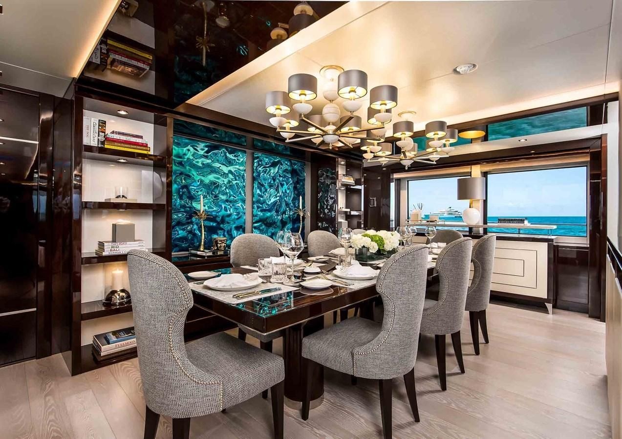 a dining room with a large table aboard CAPTAIN MORGAN III Yacht for Sale