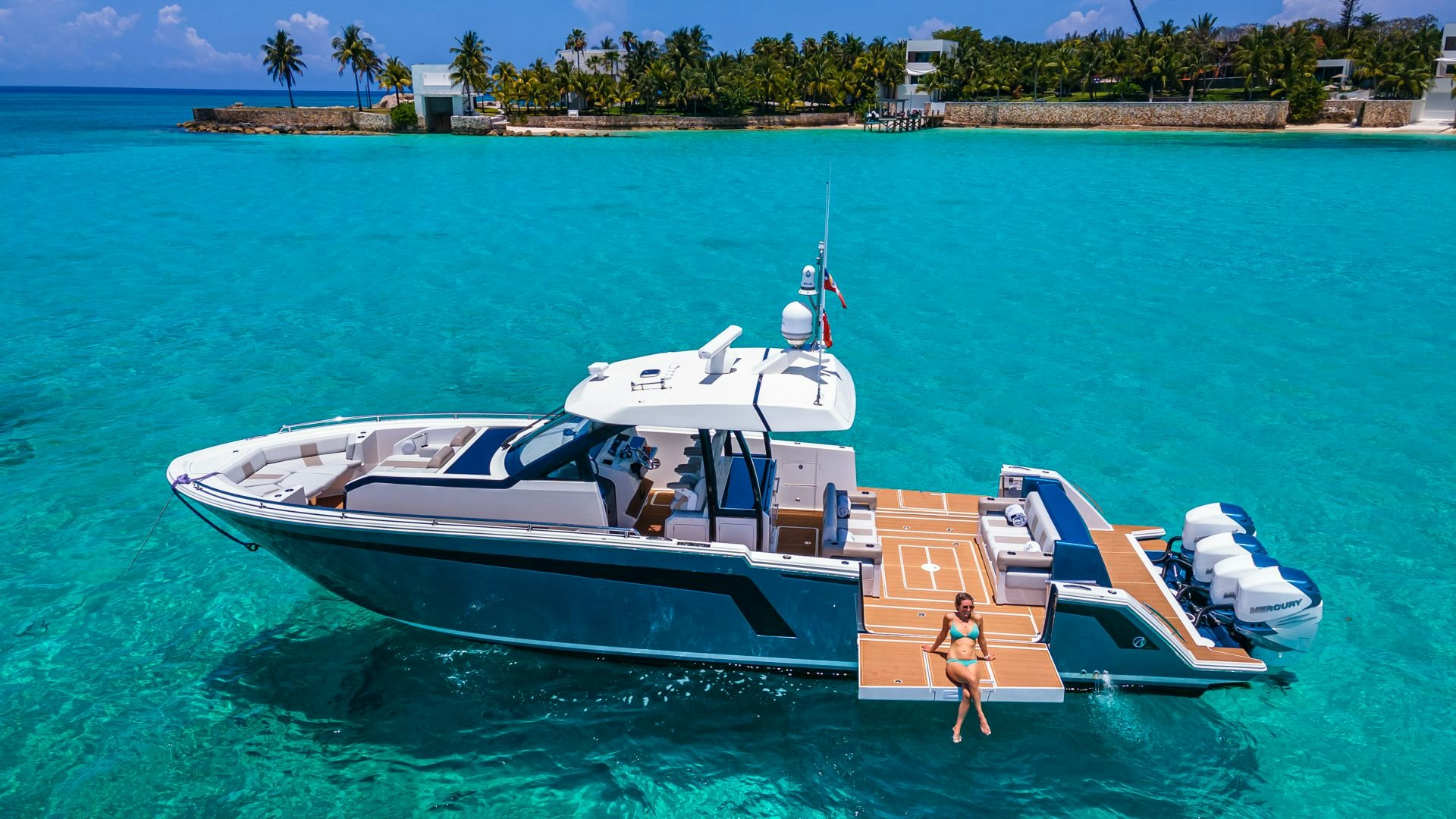 a person walking on a dock next to a boat aboard CAPTAIN MORGAN III Yacht for Sale