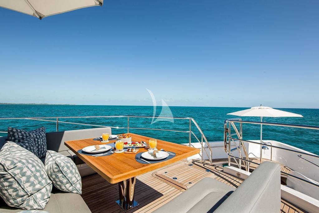 a table on a boat aboard CAPTAIN MORGAN III Yacht for Sale