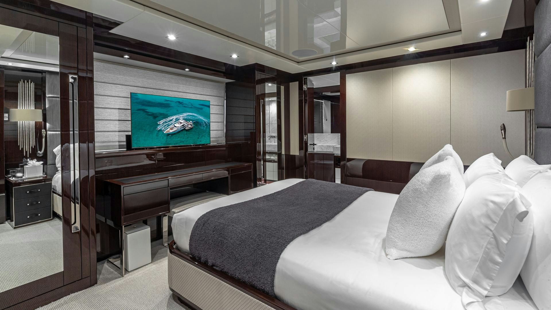 a hotel room with a large bed aboard CAPTAIN MORGAN III Yacht for Sale