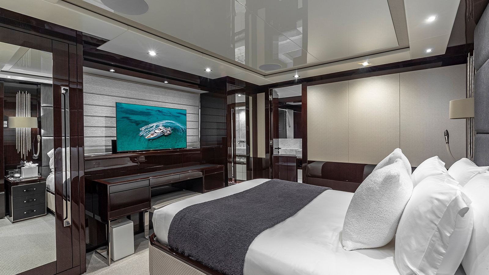 a hotel room with a tv aboard CAPTAIN MORGAN III Yacht for Sale