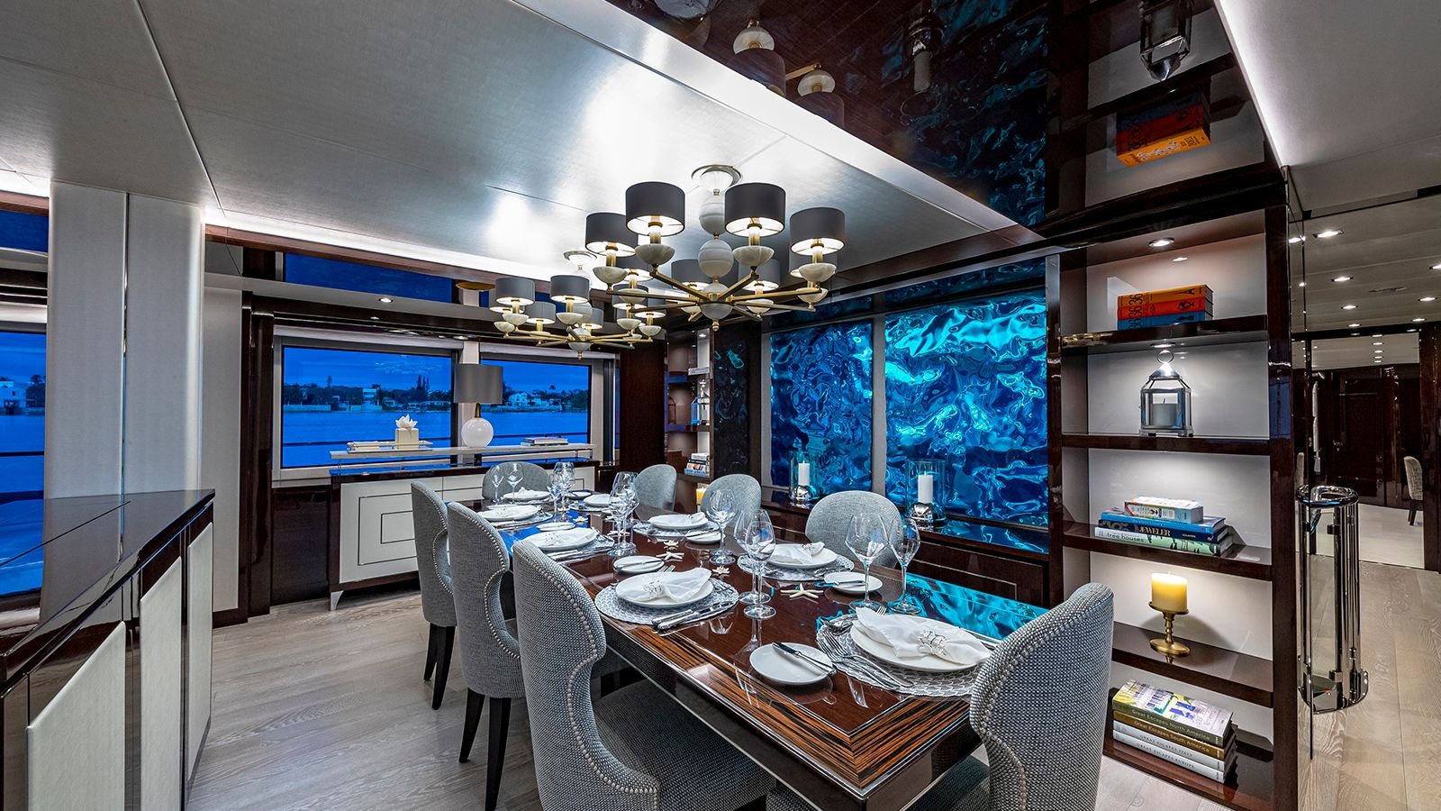 a large dining room with a large screen aboard CAPTAIN MORGAN III Yacht for Sale