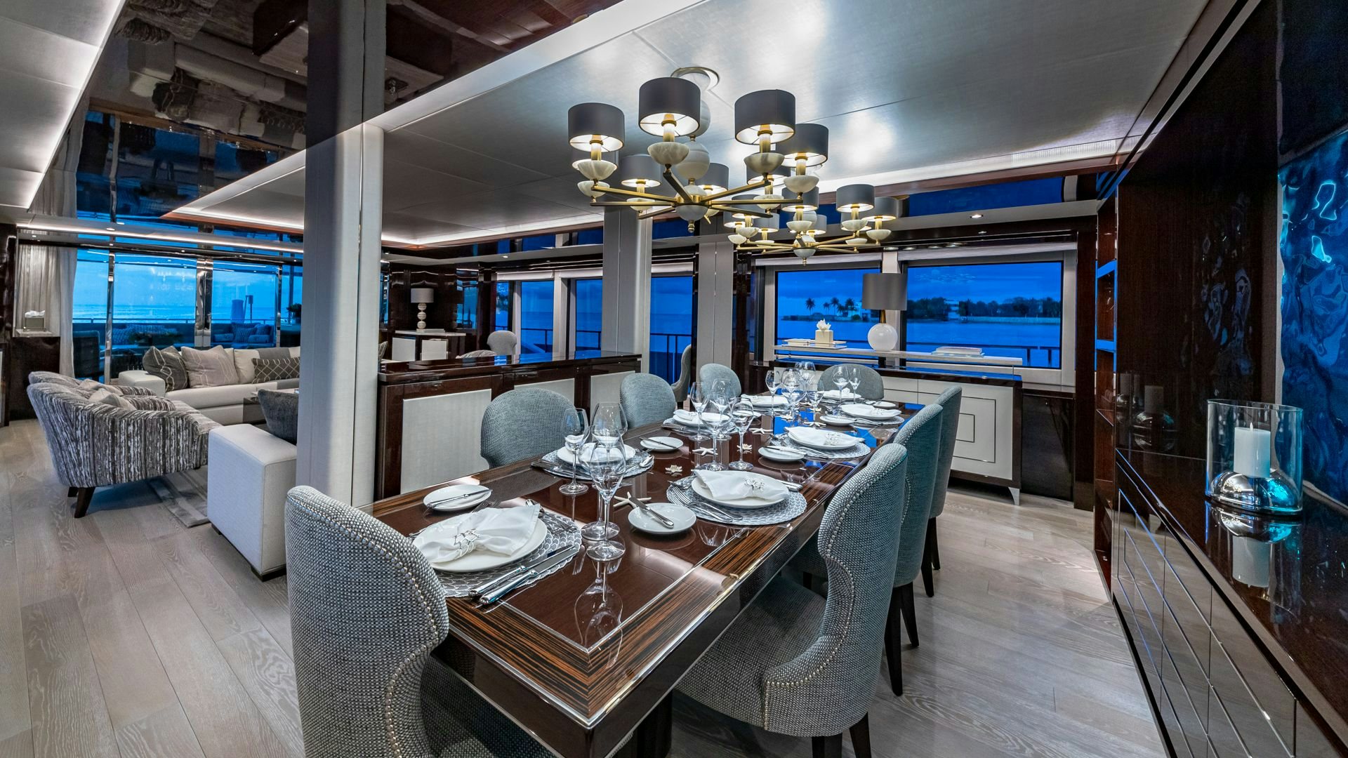 a dining room with a large table and chairs aboard CAPTAIN MORGAN III Yacht for Sale