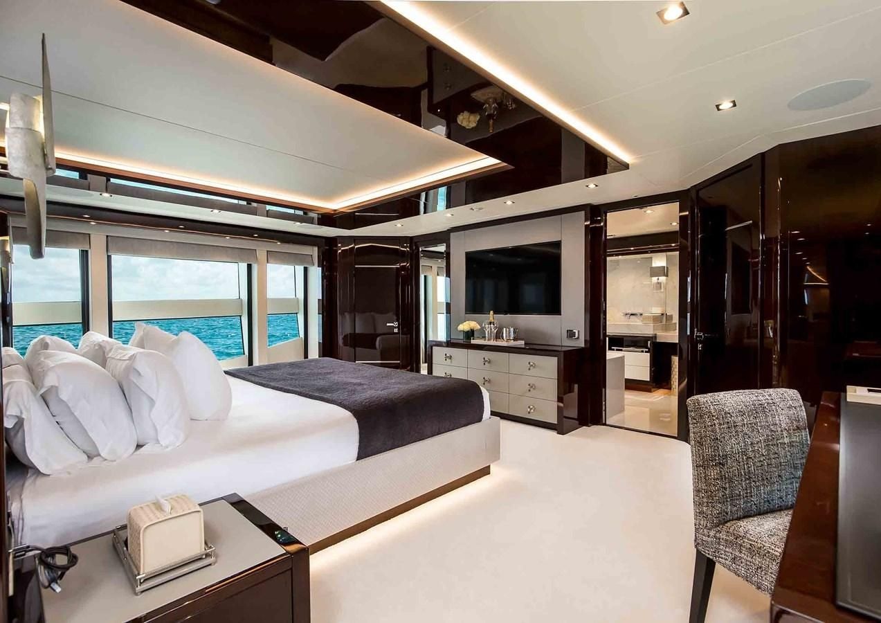 a room with a bed and a tv aboard CAPTAIN MORGAN III Yacht for Sale