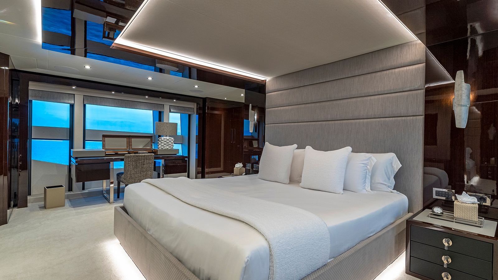 a room with a bed and a desk aboard CAPTAIN MORGAN III Yacht for Sale
