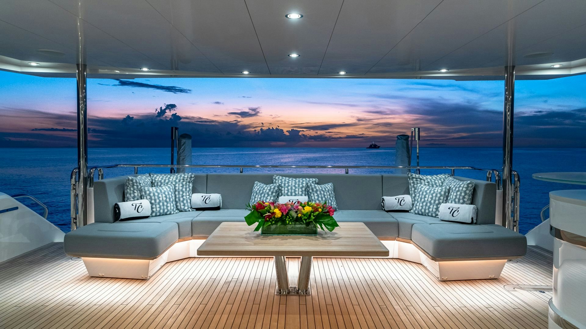 a room with a table and chairs aboard CAPTAIN MORGAN III Yacht for Sale