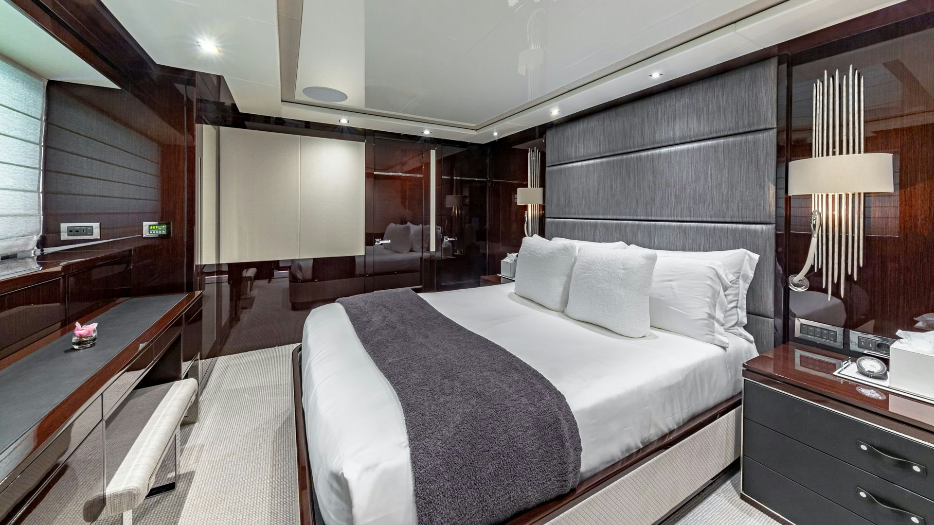 a hotel room with a bed and desk aboard CAPTAIN MORGAN III Yacht for Sale