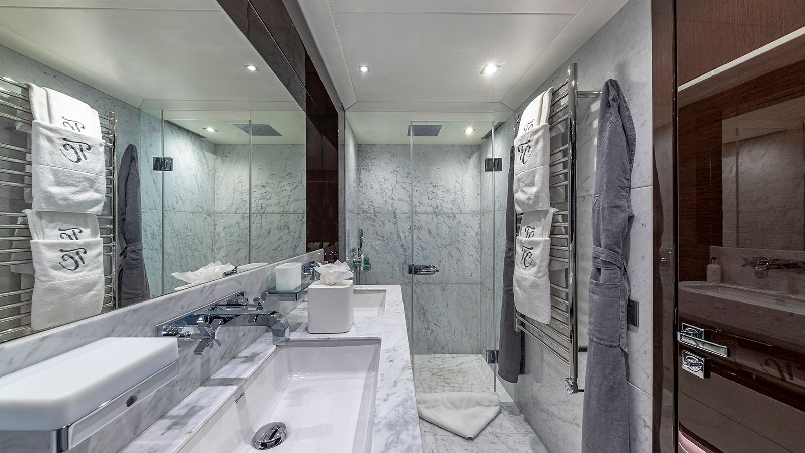 a bathroom with a sink and a shower aboard CAPTAIN MORGAN III Yacht for Sale