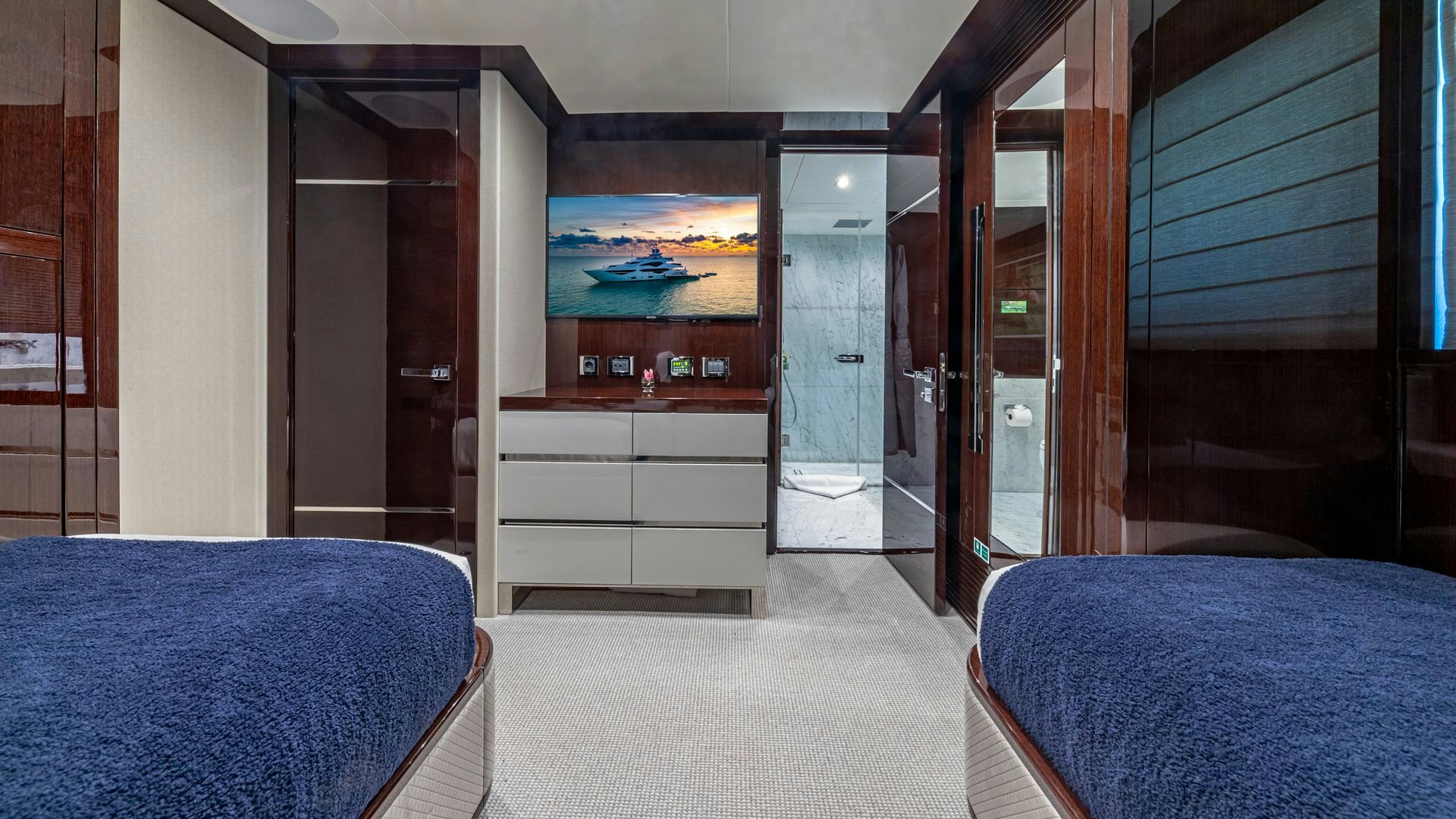 a room with a bed and a desk aboard CAPTAIN MORGAN III Yacht for Sale