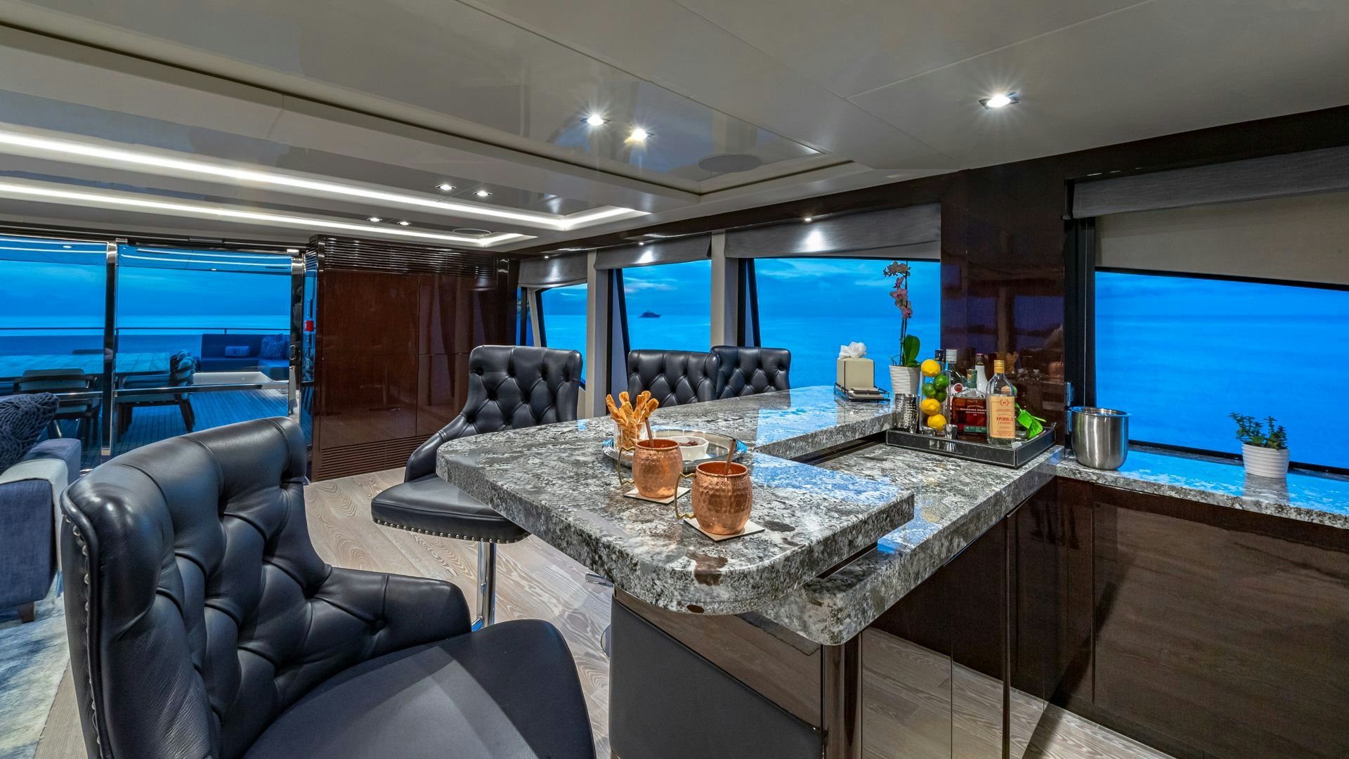 a large kitchen with a table and chairs aboard CAPTAIN MORGAN III Yacht for Sale