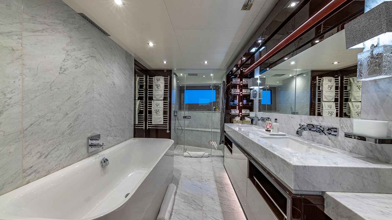a bathroom with a large mirror aboard CAPTAIN MORGAN III Yacht for Sale