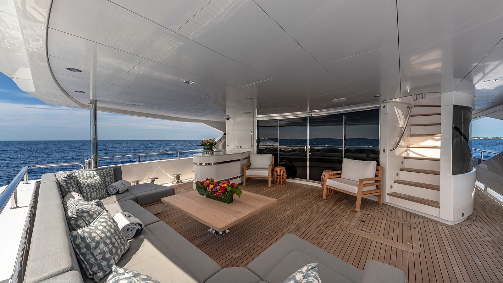 a room with a large window overlooking the ocean aboard CAPTAIN MORGAN III Yacht for Sale