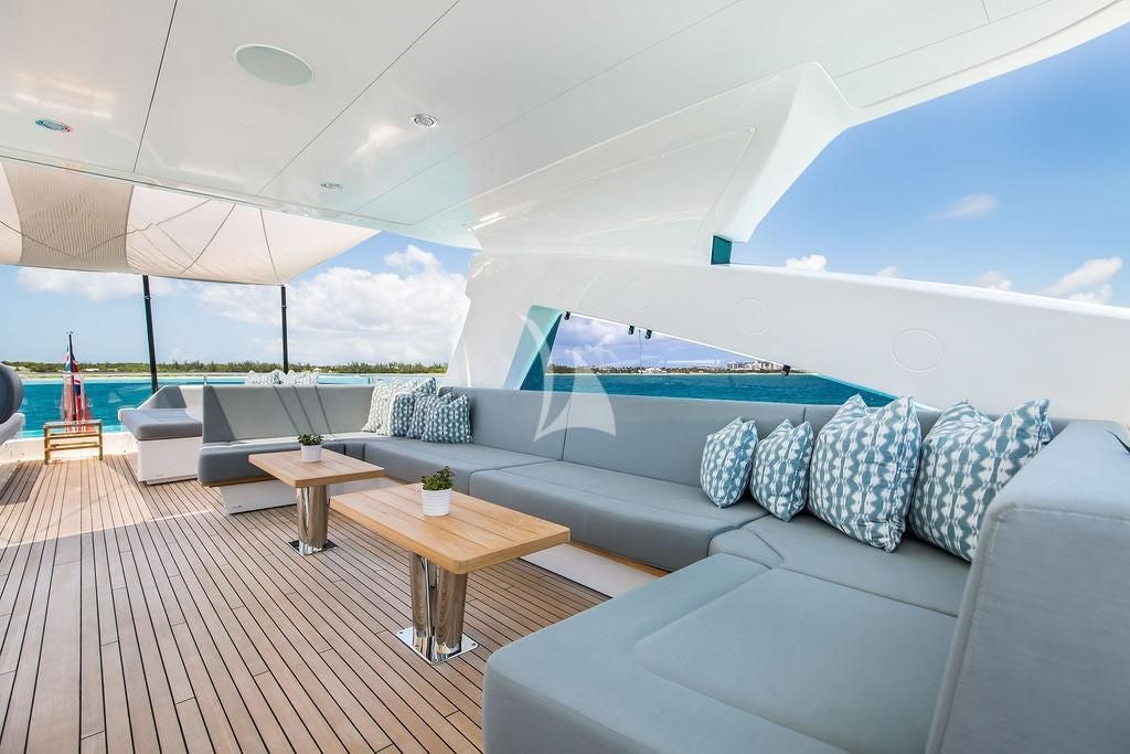 a large living room with a large patio and a large swimming pool aboard CAPTAIN MORGAN III Yacht for Sale