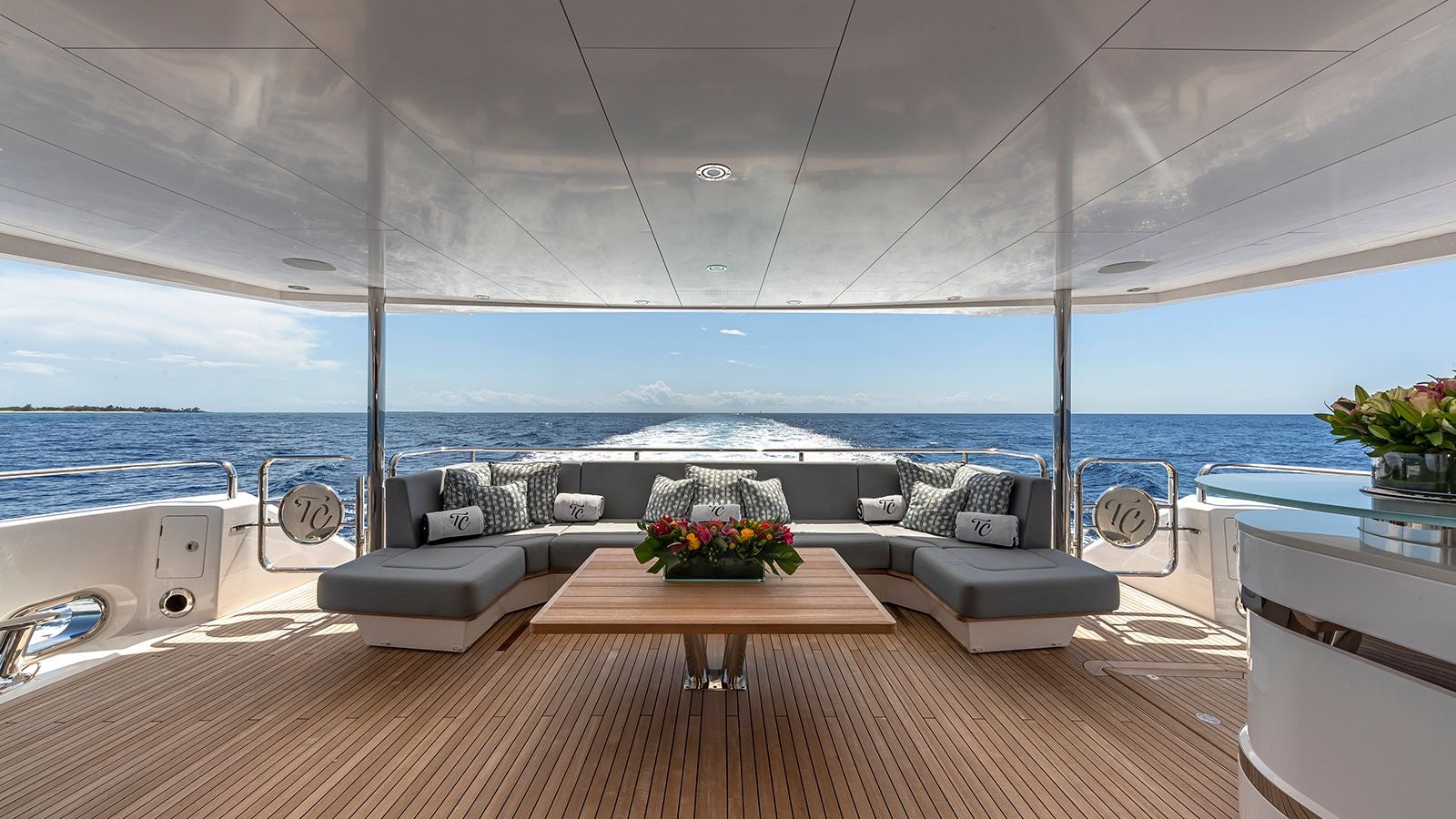 a room with a couch and a table and chairs aboard CAPTAIN MORGAN III Yacht for Sale