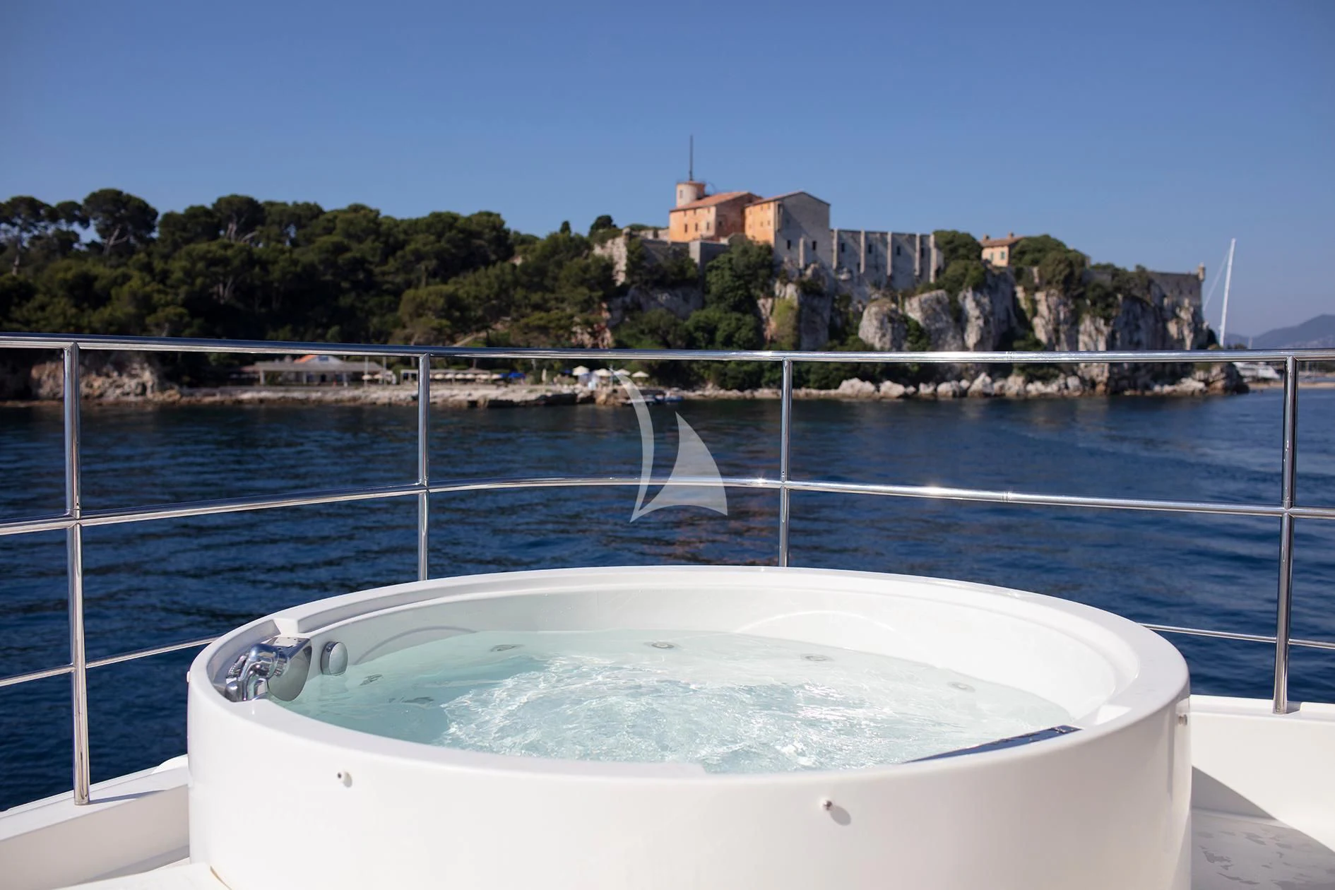 a swimming pool with water and a building in the background aboard BEST OFF Yacht for Charter