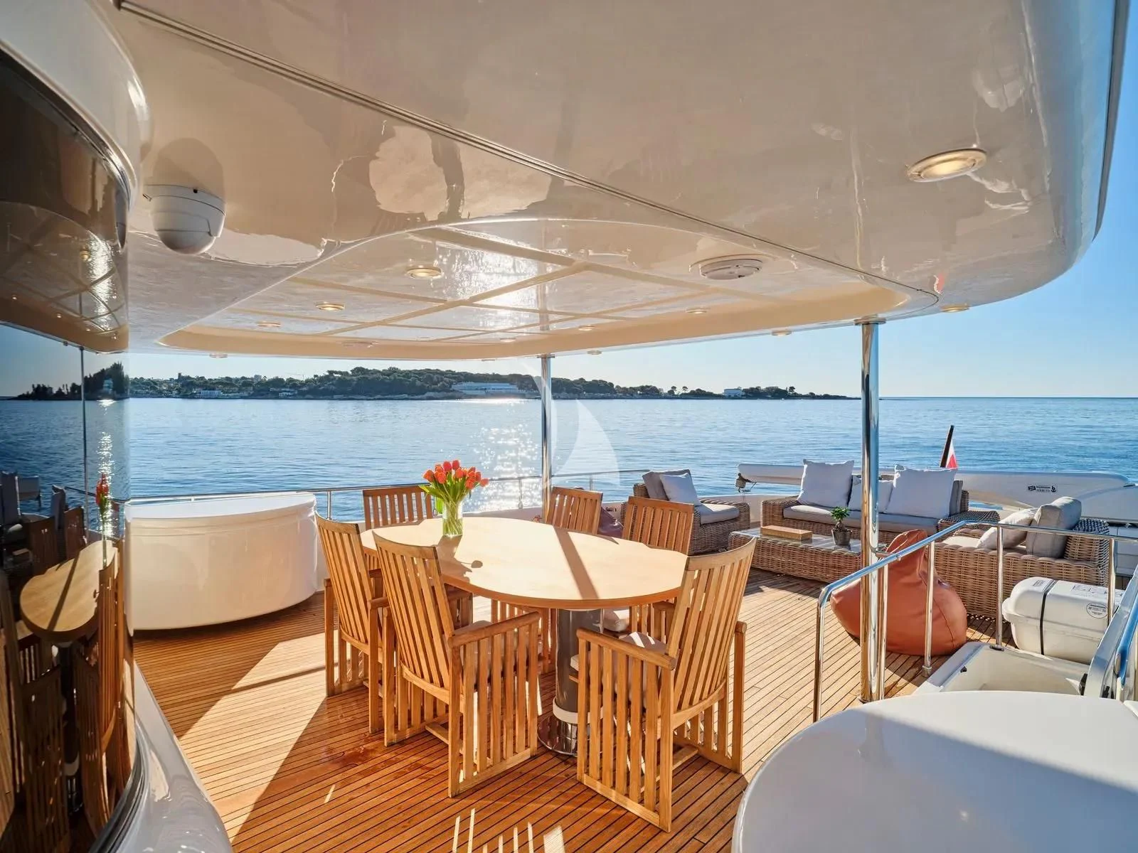 tables and chairs on a boat aboard BEST OFF Yacht for Charter