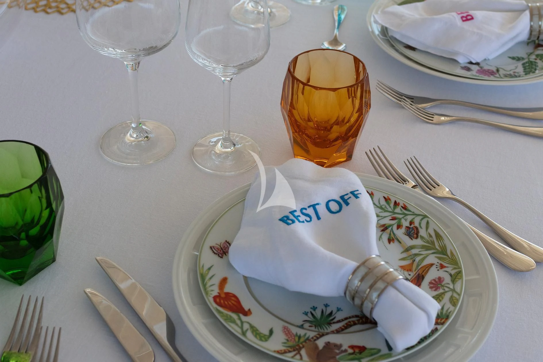 a plate with a drink and glasses on it aboard BEST OFF Yacht for Charter