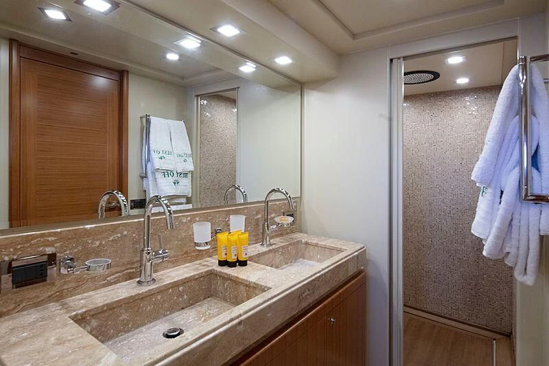 a bathroom with a sink and a mirror aboard BEST OFF Yacht for Charter