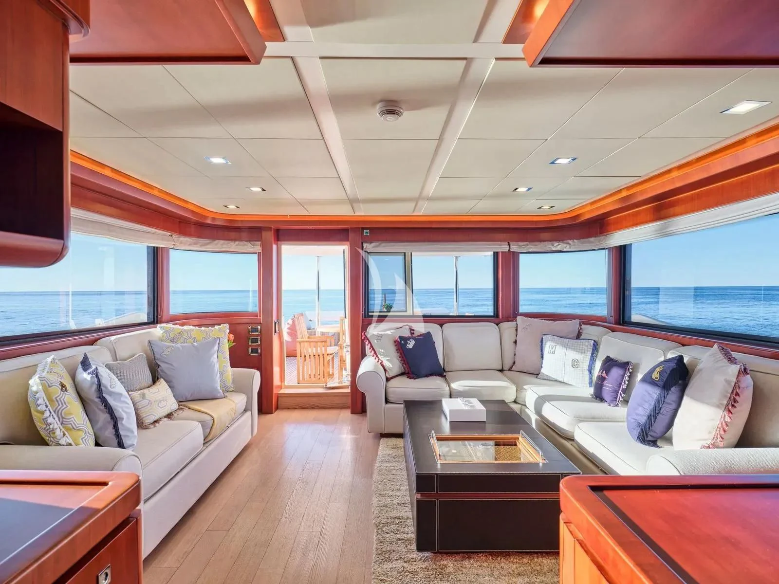 a living room with a couch and a table aboard BEST OFF Yacht for Charter