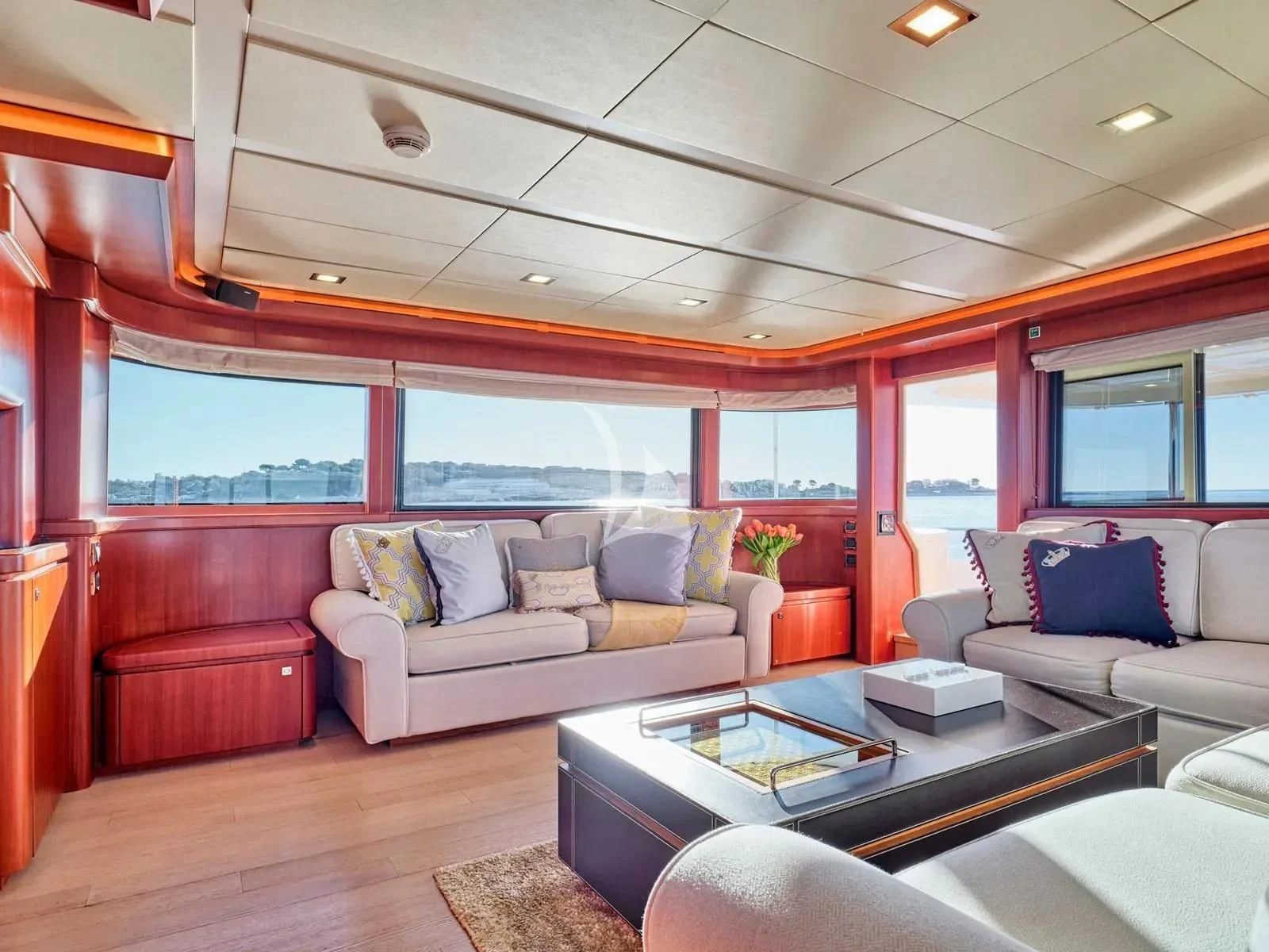 a living room with a couch and a coffee table aboard BEST OFF Yacht for Charter