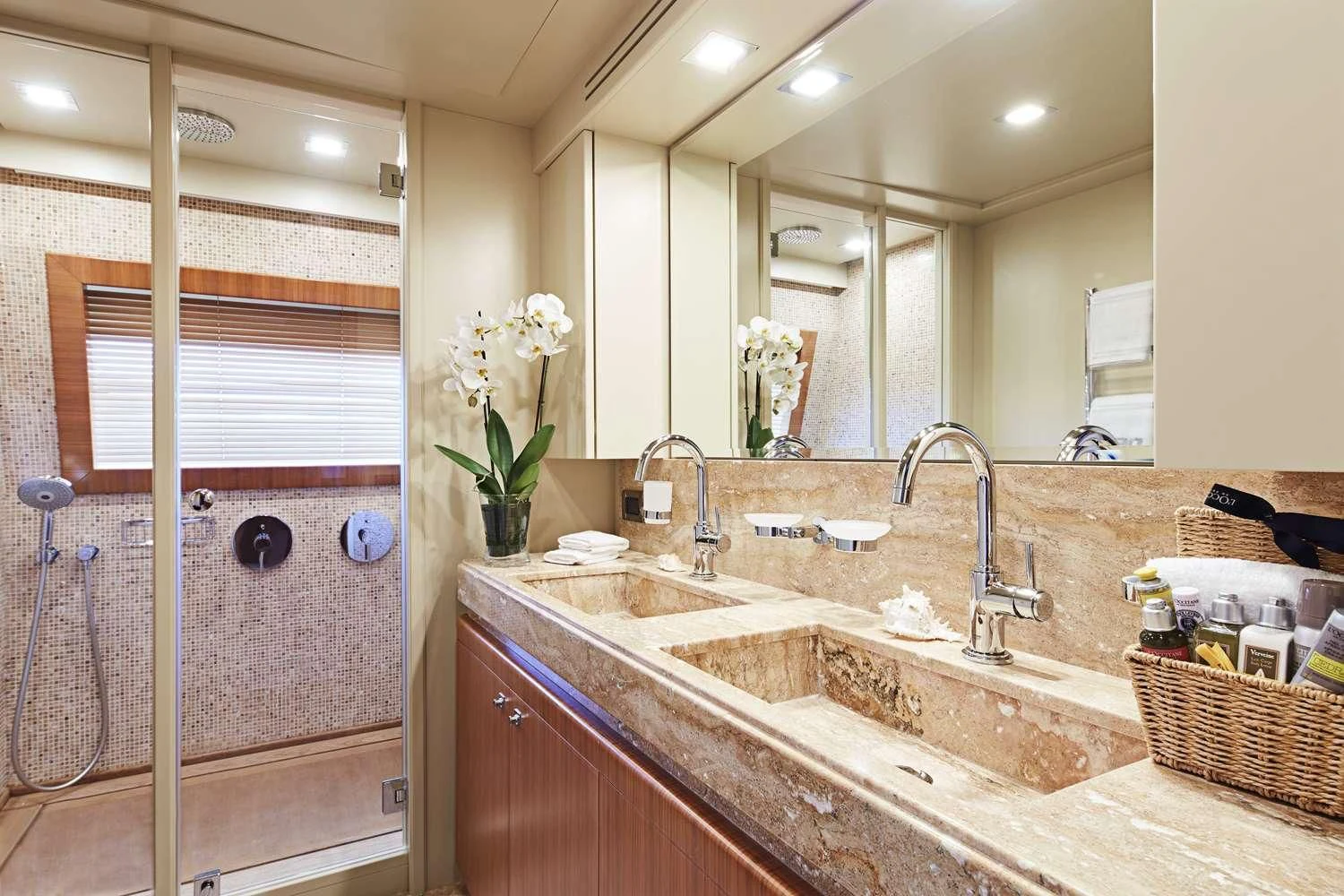 a bathroom with a sink and a shower aboard BEST OFF Yacht for Charter