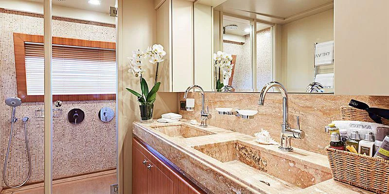 a bathroom with a sink and a mirror aboard BEST OFF Yacht for Charter