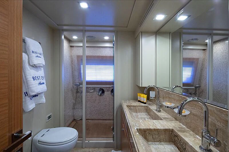 a bathroom with a sink and a shower aboard BEST OFF Yacht for Charter