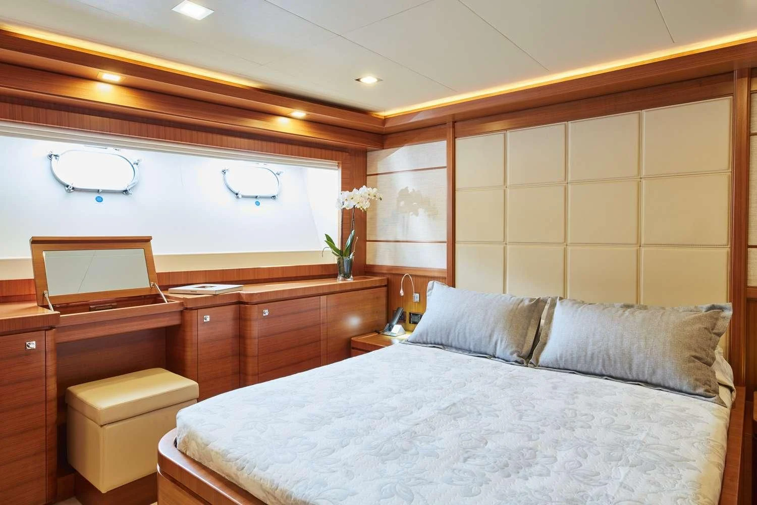 a bedroom with a bed and a desk aboard BEST OFF Yacht for Charter