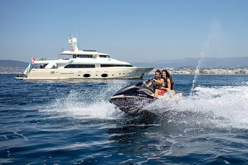 a couple of people on a speed boat in the water aboard BEST OFF Yacht for Charter