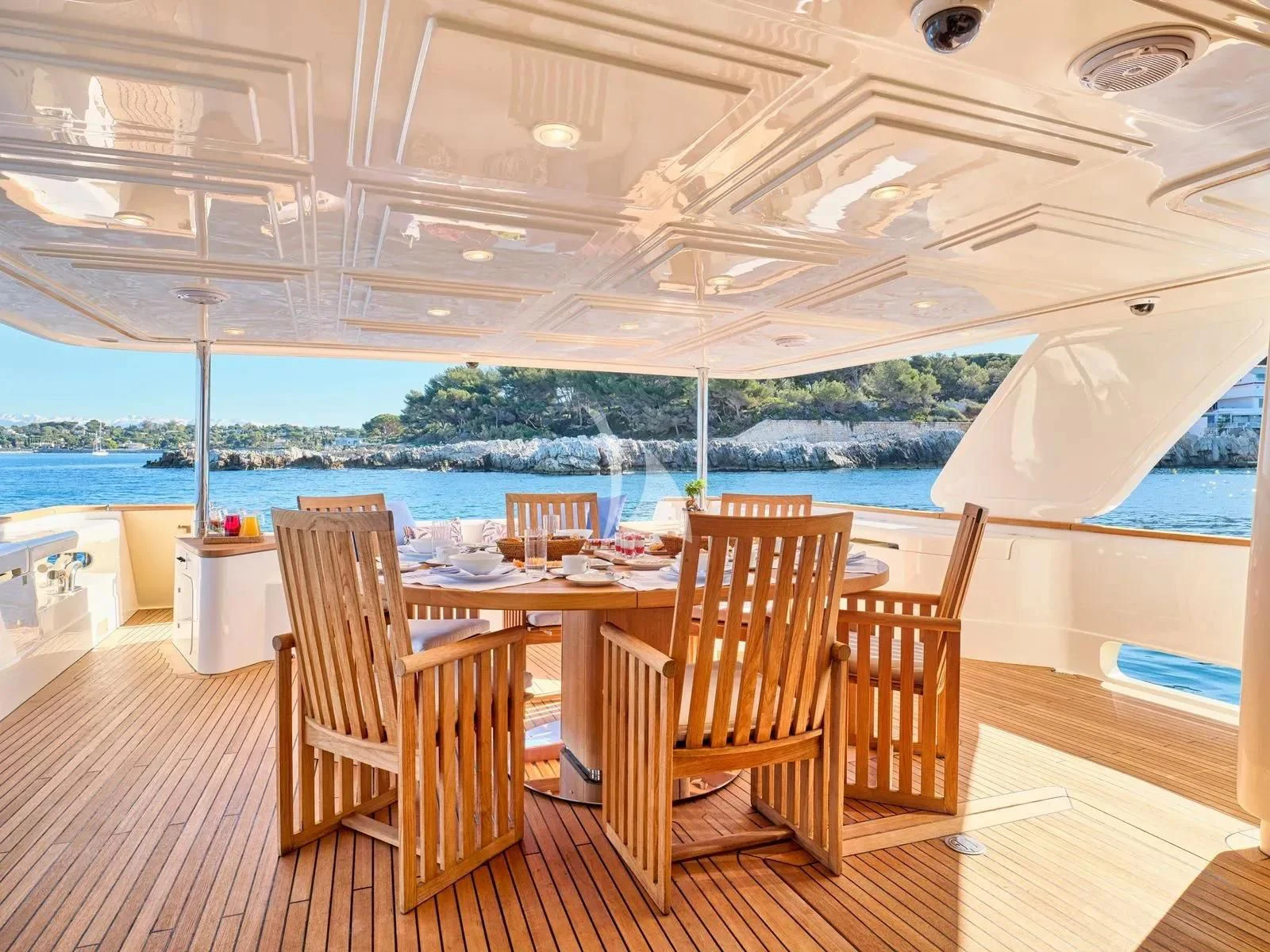 a table and chairs on a deck aboard BEST OFF Yacht for Charter