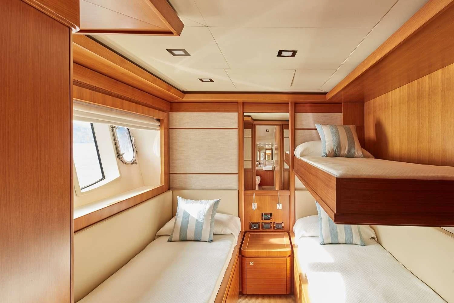 a room with a bed and a desk aboard BEST OFF Yacht for Charter