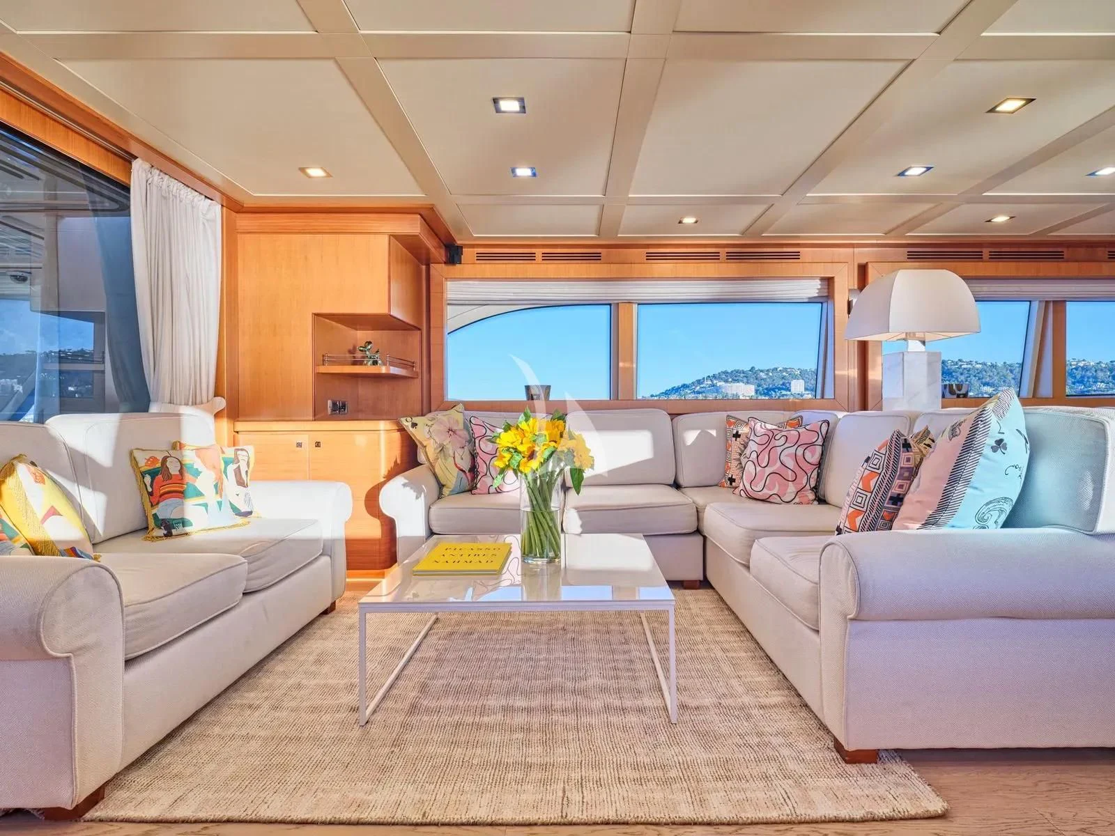a living room with a large window aboard BEST OFF Yacht for Charter