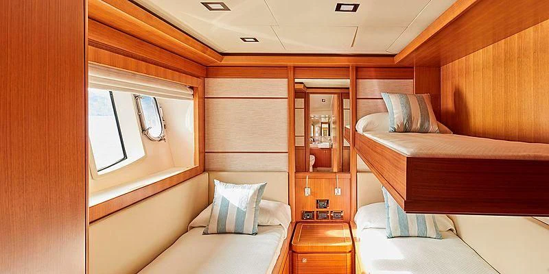 a room with a bed and a mirror aboard BEST OFF Yacht for Charter