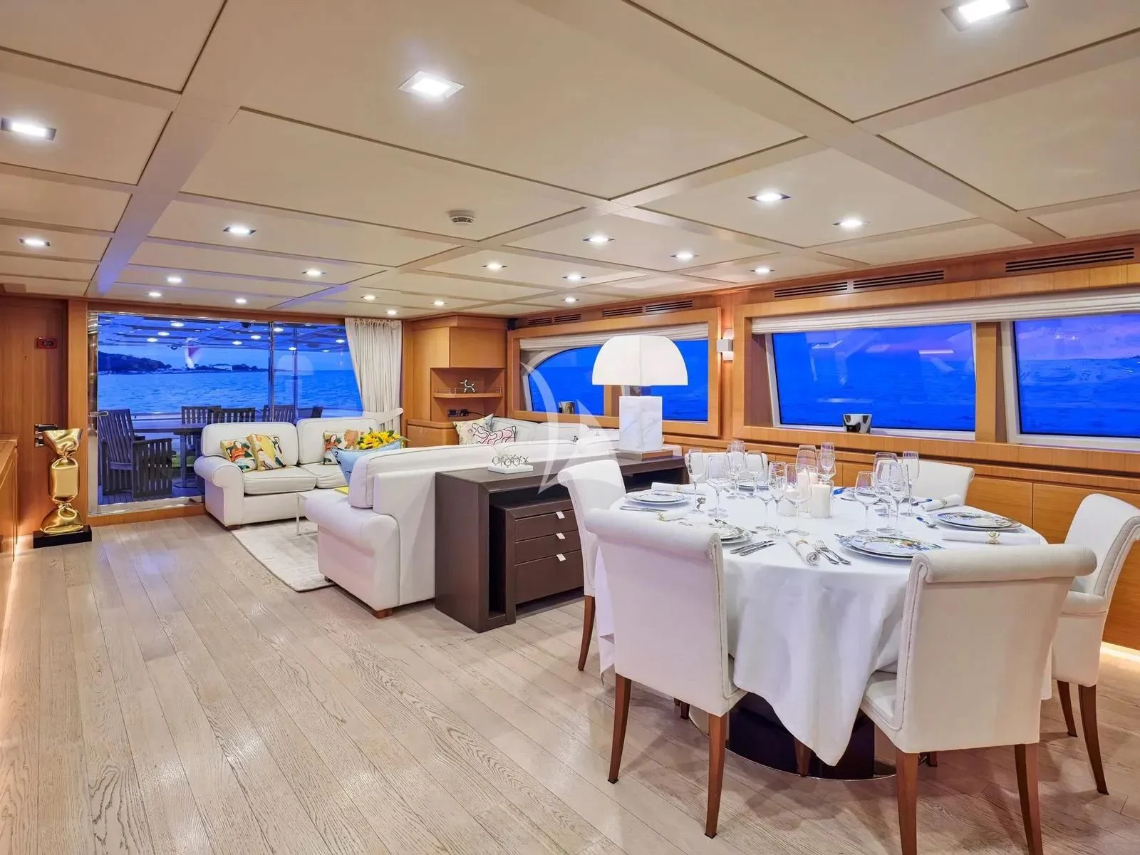 a large room with tables and chairs aboard BEST OFF Yacht for Charter