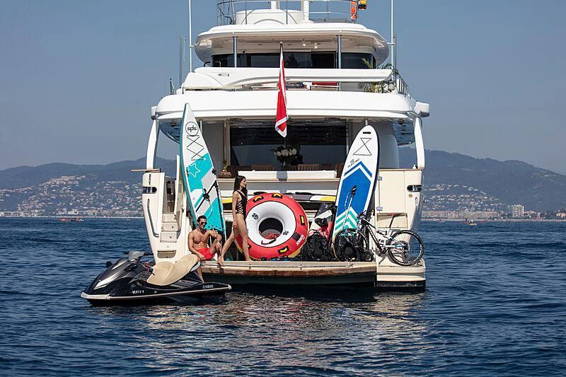 a boat with a flag on it aboard BEST OFF Yacht for Charter